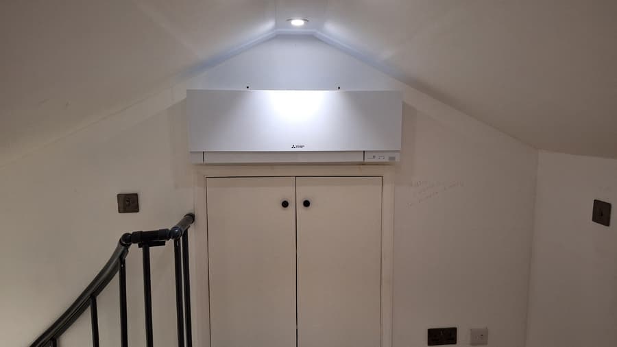 Mitsubishi air conditioning unit in vaulted loft space