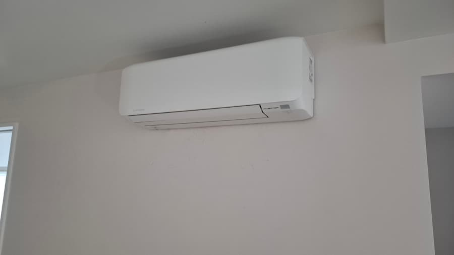 Minimal white wall mounted indoor air conditioning unit