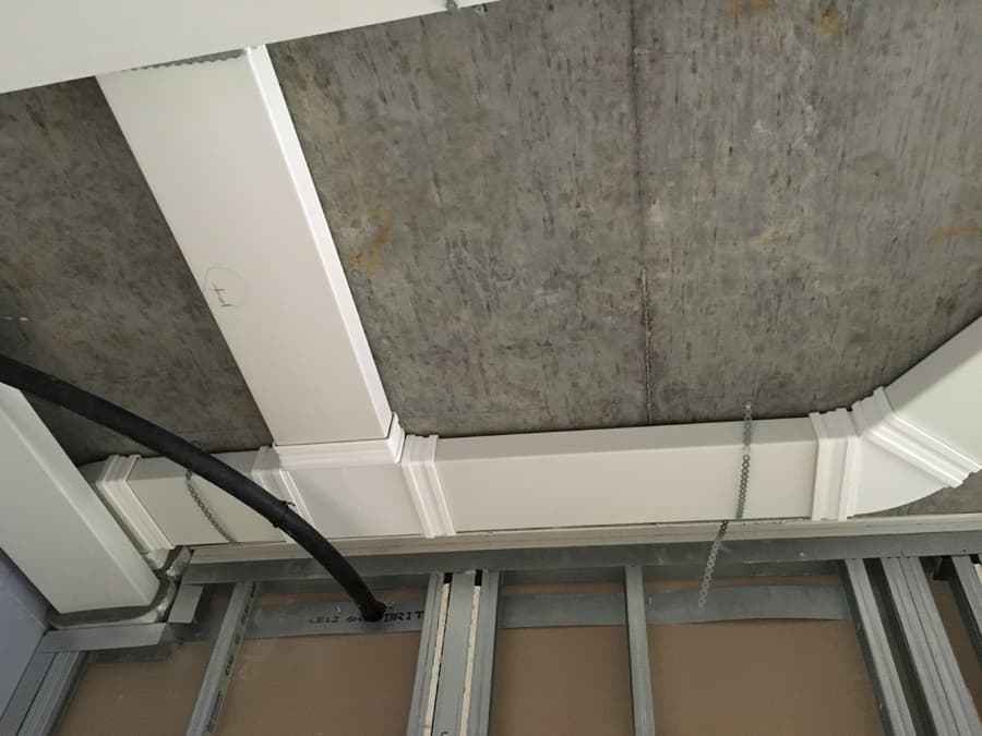 Commercial MVHR rectangular trunking ceiling run on concrete soffit