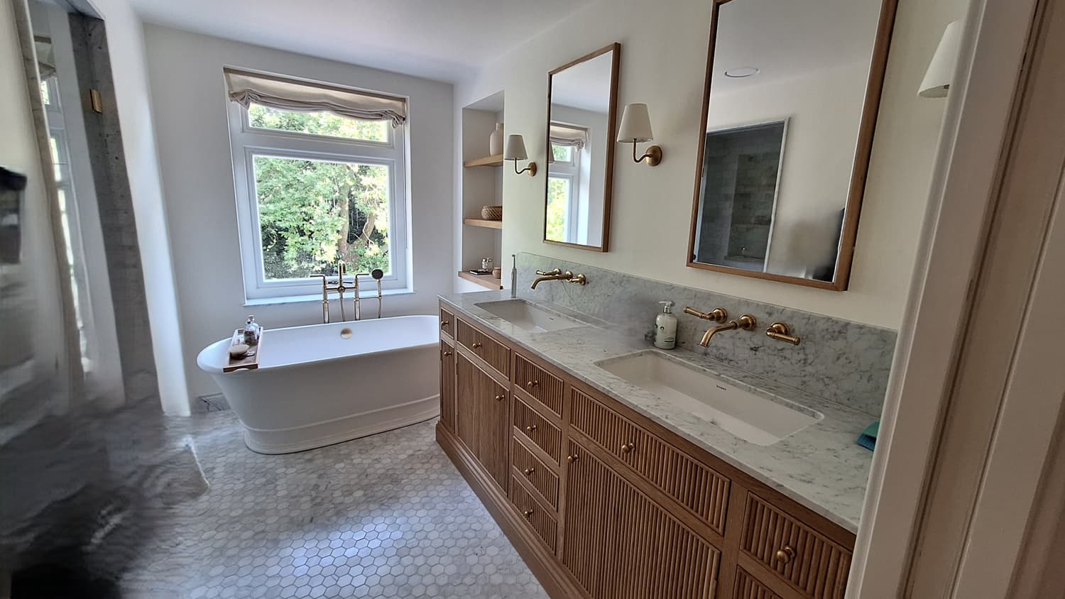 Luxury bathroom plumbing installation with marble vanity and brass fixtures by EGFF Ltd plumbers in London