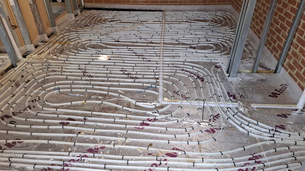 Wet underfloor heating pipework laid out before screed