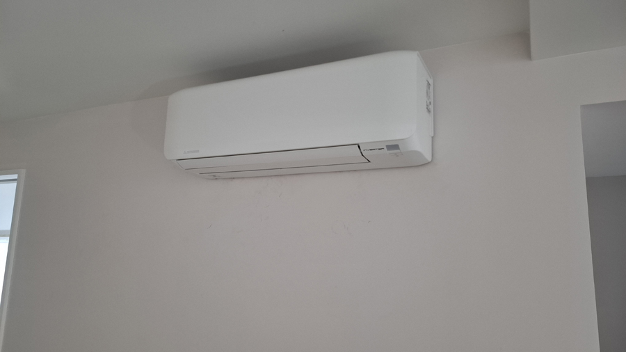 Minimal white wall mounted indoor air conditioning unit